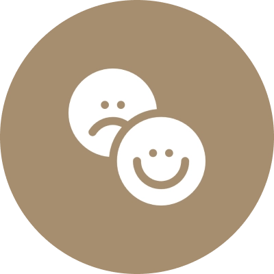 Two smiley faces with one smiling and the other sad.
